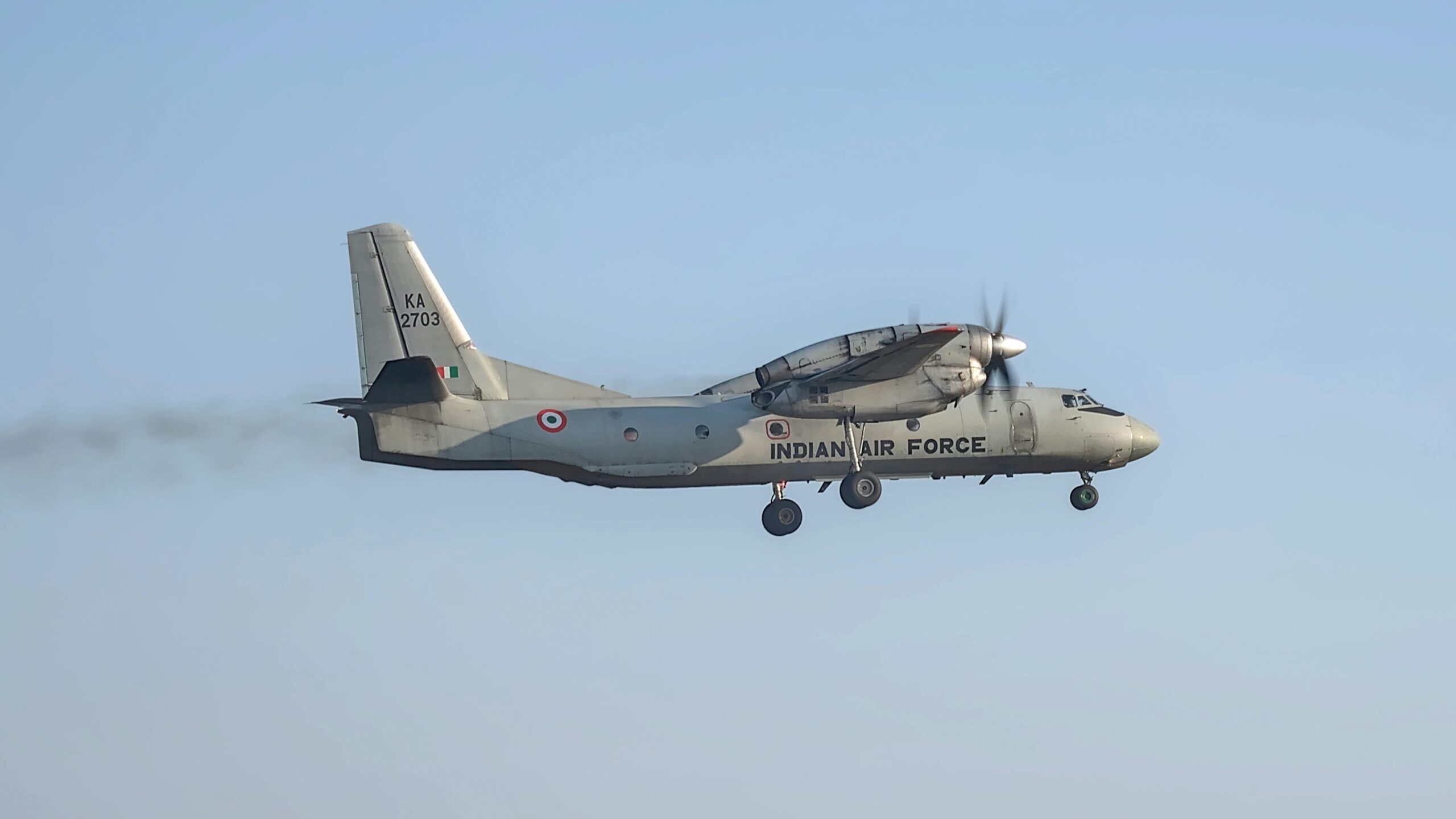Indian Air Force aircraft captured mid-flight with clear blue skies in Bengaluru.